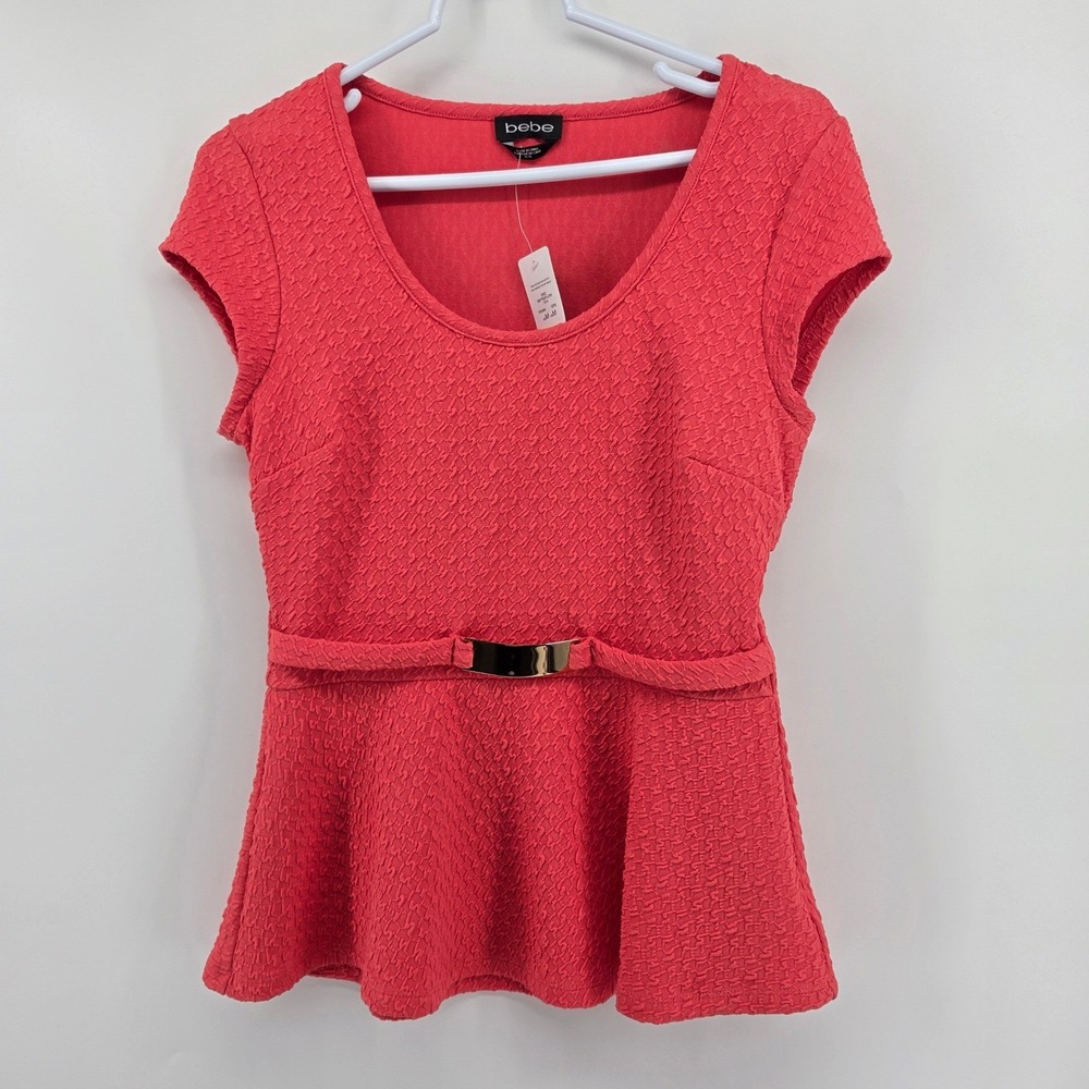 Bebe Trina Texture Peplum Top Size M Gold Buckle Back Cutout Coral Pink NWT
